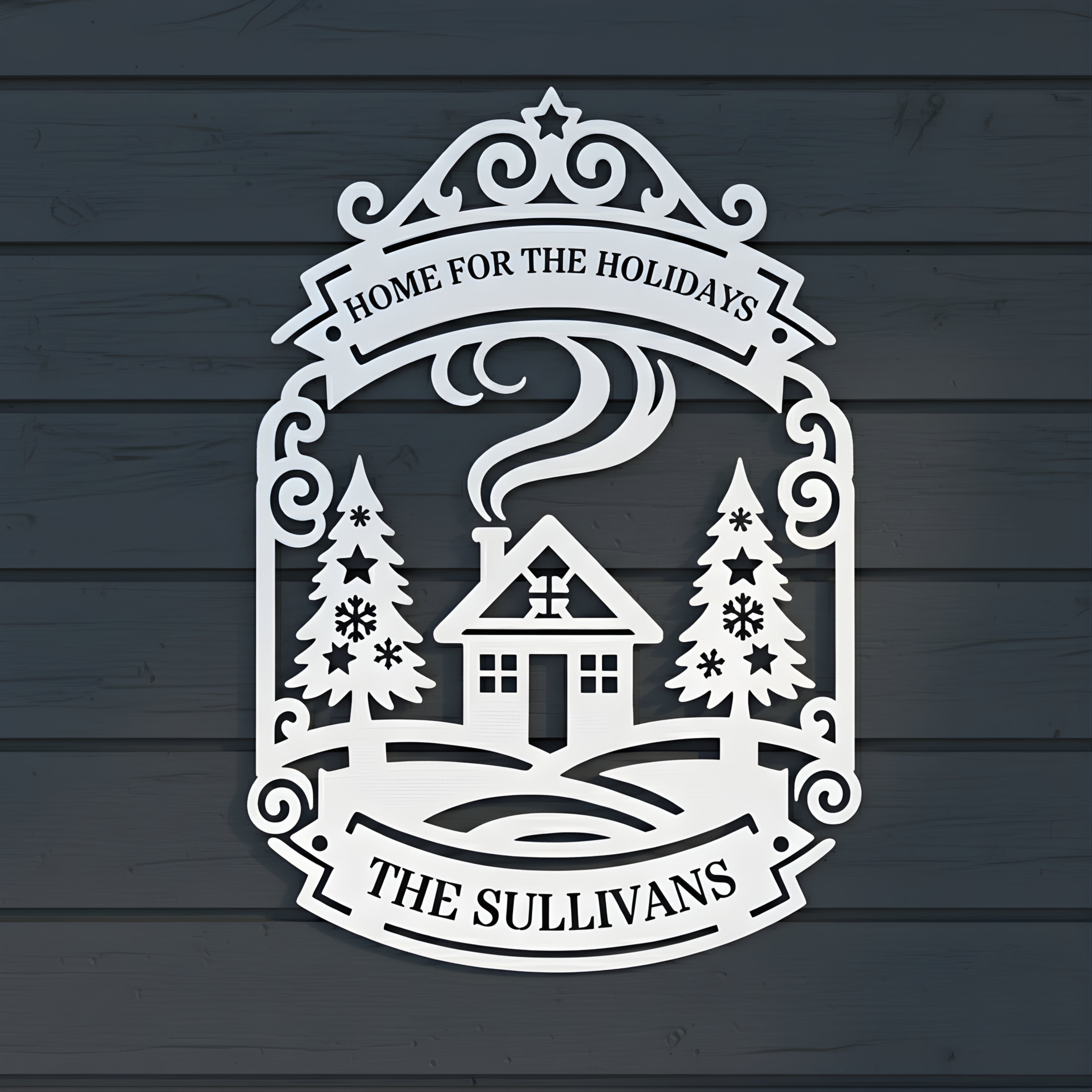 Decorative metal sign with a house and trees design on a wooden background